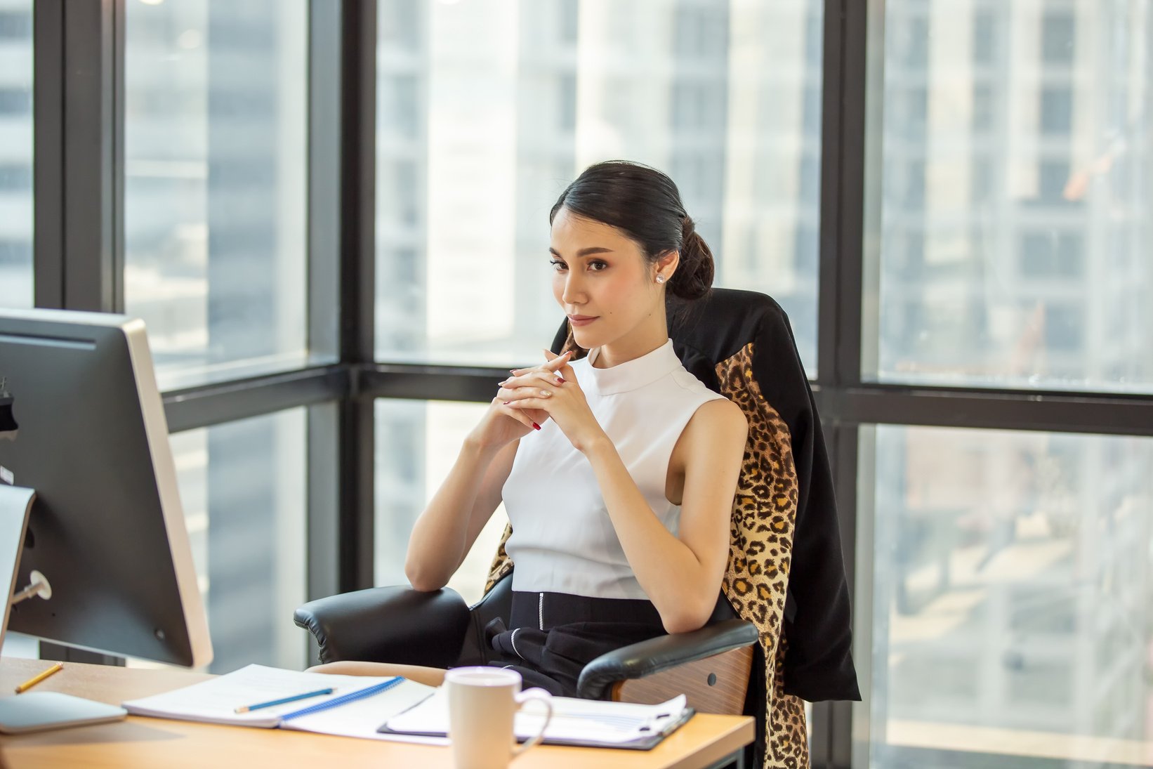 Female Boss Sitting on Her Office